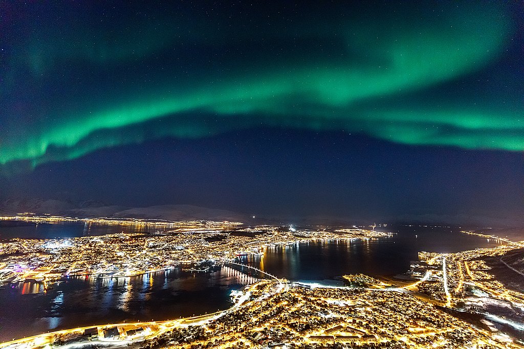 Incredible Northern lights Aurora Borealis activity above town o